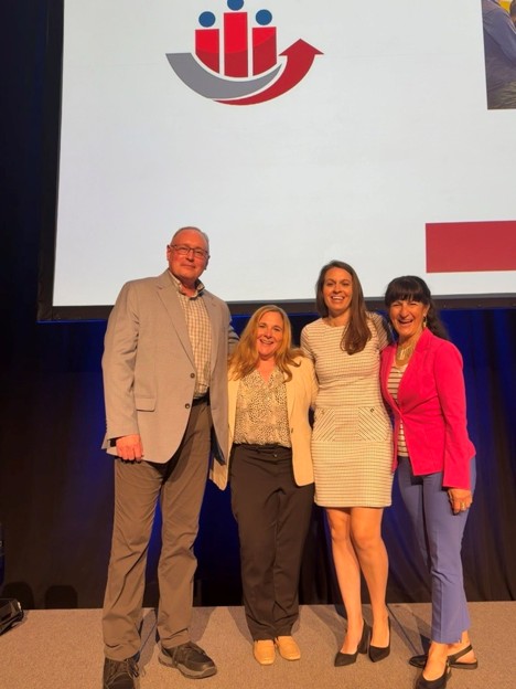 people-6 Image of David Dorsey, Kimberly Adams, Genevieve Ainslie, and Suzanne Tsacoumis at the SIOP conference
